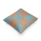 A side view of the Danish Blue Vintage Salmon Checker Woven Pillow showing danish blue checker squares on a salmon red background.