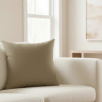Dark neutral wood faux suede pillow styled on sofa, rich creamy, dark brown home decor.