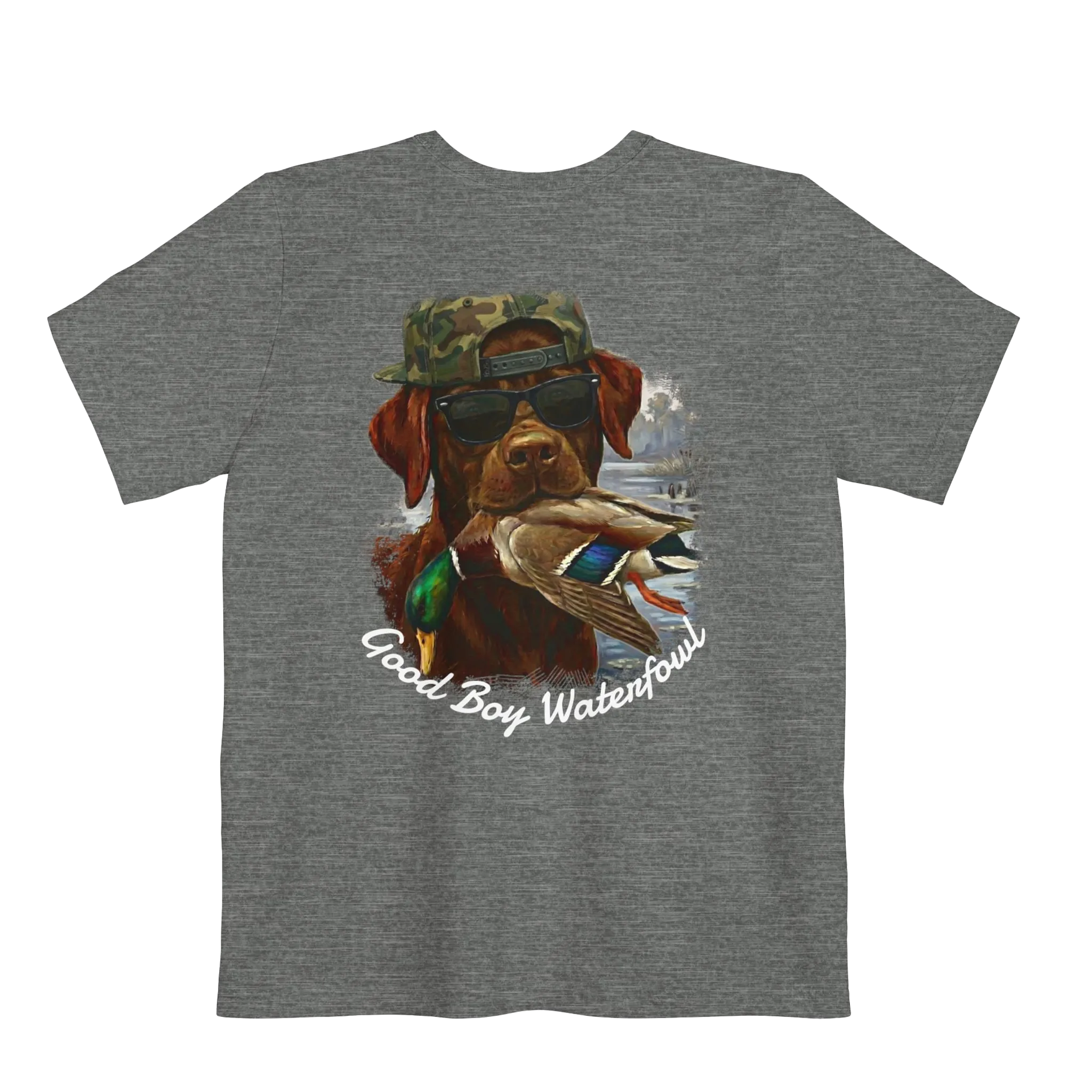 A deep heather t-shirt featuring the Good Boy Waterfowl graphic of a chocolate Labrador wearing sunglasses and a camo snapback, holding a mallard duck, with a watercolor outdoor scene and 'Good Boy Waterfowl' script below.