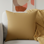 Driftwood brown faux suede pillow styled on sofa, earthy neutral home decor.