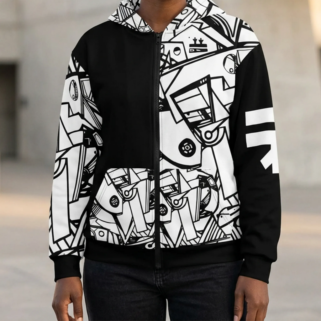 Black zip-up hoodie worn on a model, showing contrasting geometric artwork on the hood, one front panel, front pockets and one sleeve, with a white FREEBRD logo on the opposite sleeve.