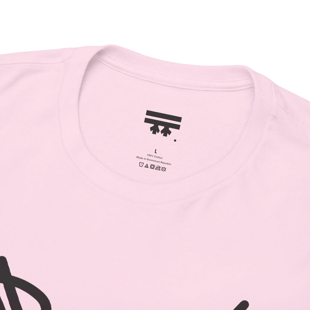 Graphic heart t-shirt inner neck label showing 100% cotton, Light Pink, collar detail.