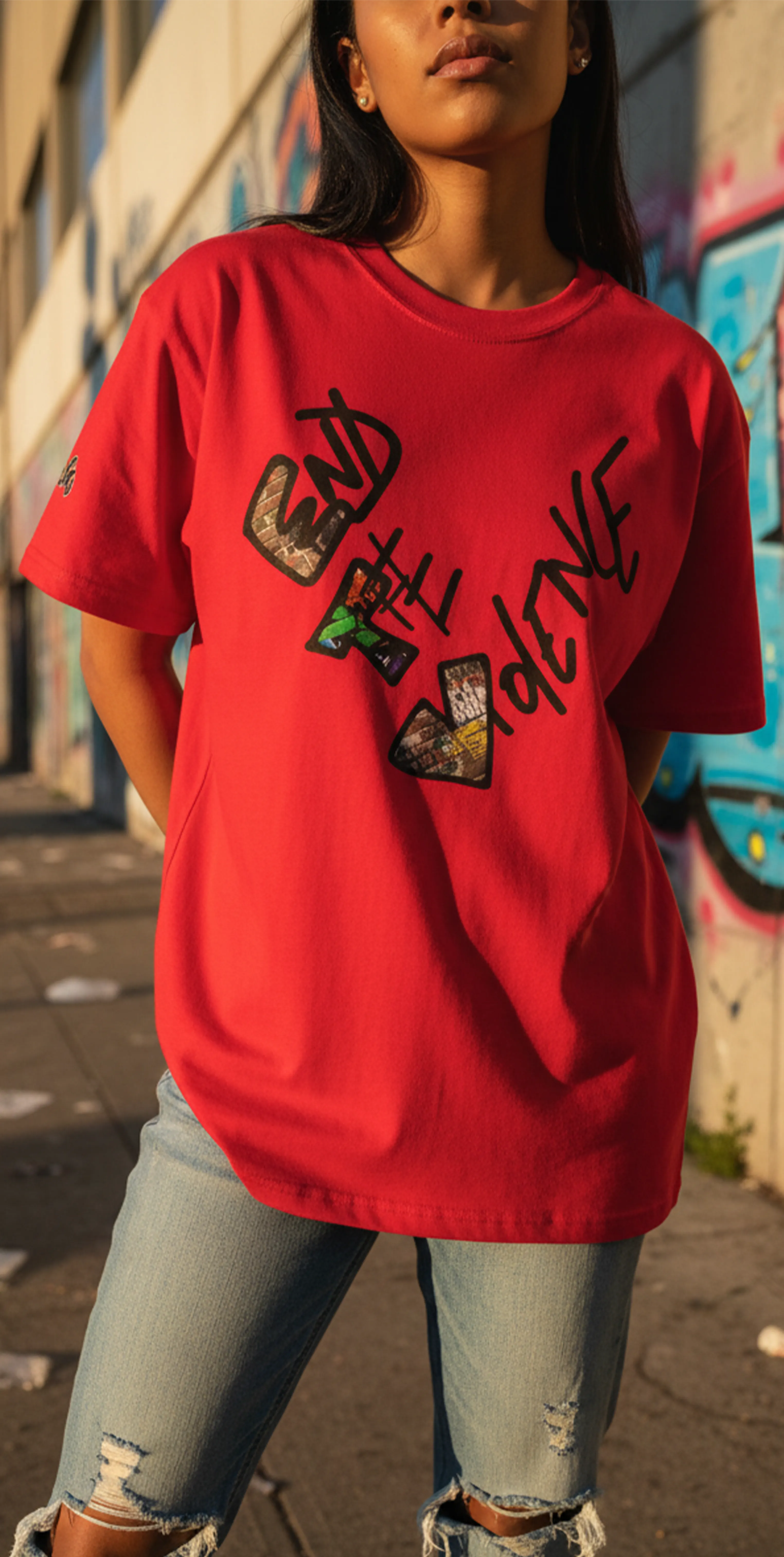 Graphic heart t-shirt with graffiti-style "End the Violence" mixed-media art, red, street urban lifestyle, feminine worn view.