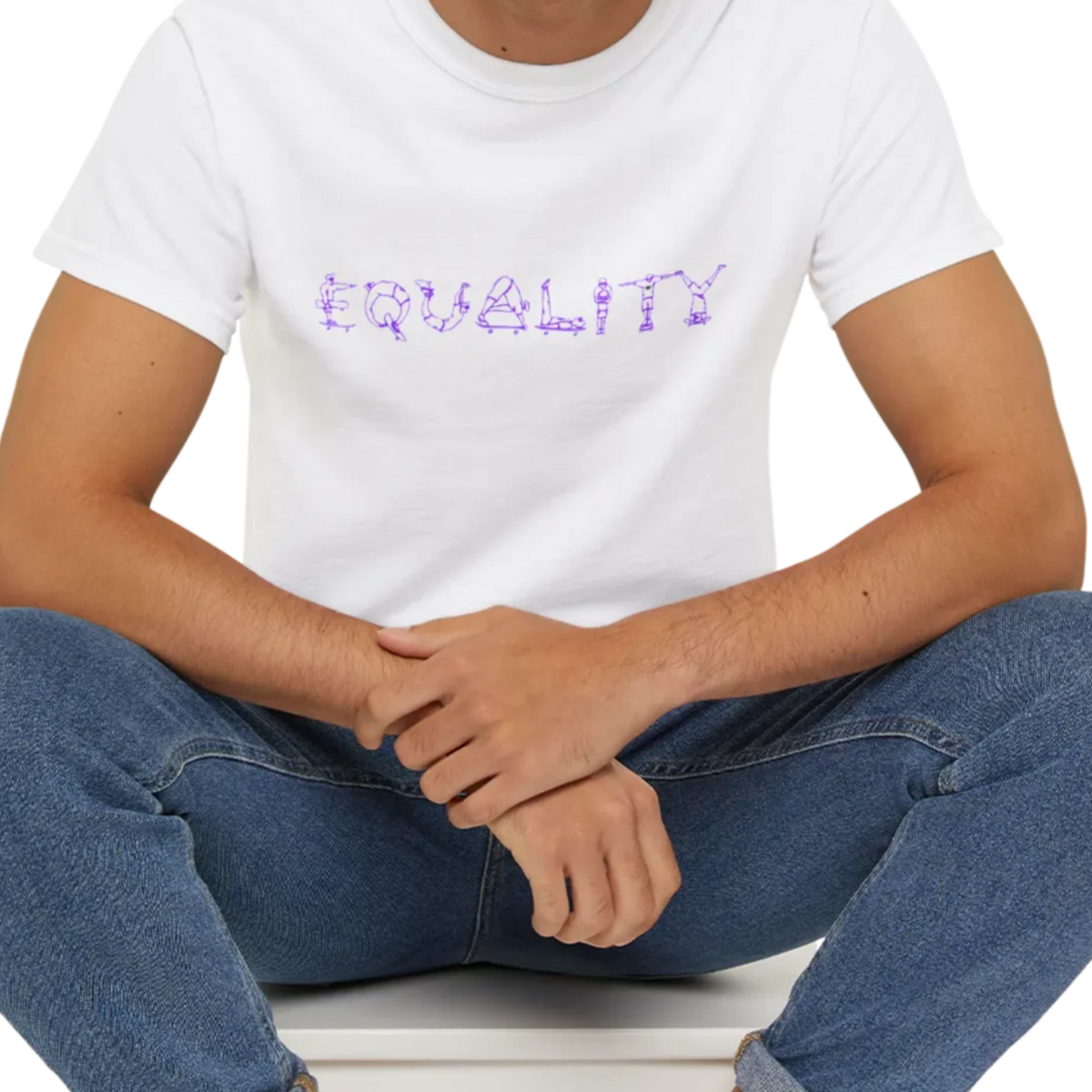 EQUALITY skater script graphic tee, white, front view on person, seated relaxed pose.
