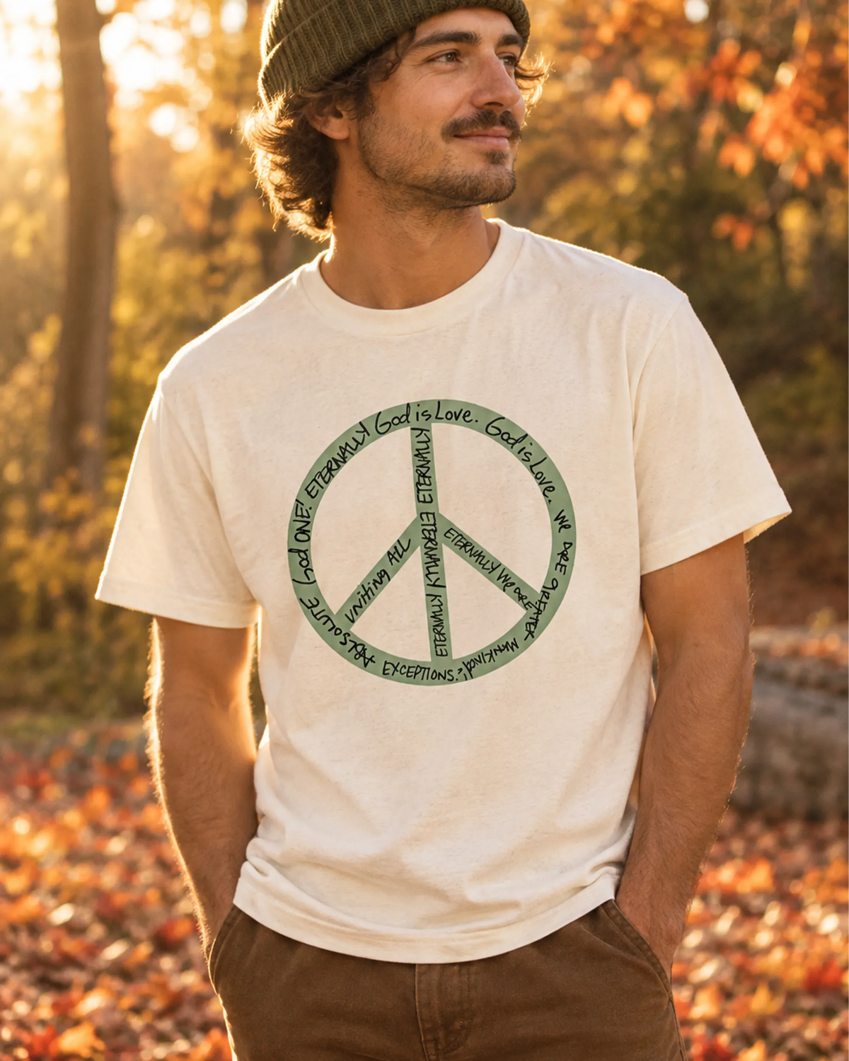 Eternal Peace Symbol tee in natural, lifestyle photo outdoors in a fall setting with autumn leaves.