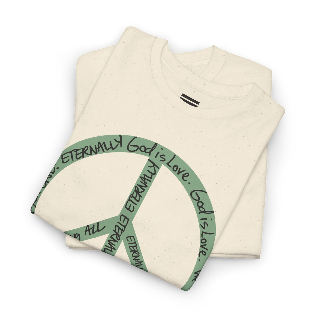 Folded natural cotton tee showing part of a large sea green peace symbol made from circular handwritten lettering.