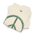 Folded natural cotton tee showing part of a large sea green peace symbol made from circular handwritten lettering.