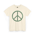 Natural cotton tee with a large sea green peace symbol made from circular handwritten lettering that reads God is love, we are greater mankind, eternally, eternally, front view.