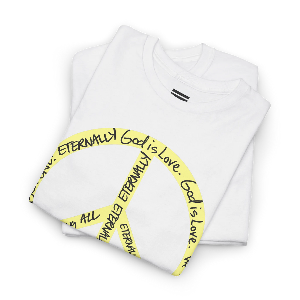 Folded white cotton tee showing part of a large yellow peace symbol made from circular handwritten lettering.
