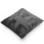 A side view of the Faded Geometric Net Patterned Woven Pillow showing a black background and abstract black and white hash grid lines.