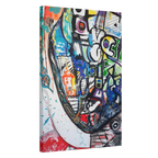 A side view of the contemporary Freebrd "Frankly" surrealistic geometric facial abstractions wall art, on a 1.5 inch thick canvas, showcasing blues, reds, purples, grey hues, beige, yellows and orange tones.