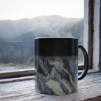 Freebrd Afrostar color changing mug lifestyle shot showing heat reactive abstract acrylic pour artwork revealed by hot liquid on 11oz ceramic mug.