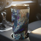 Freebrd Afrostar stainless steel travel mug in a car cupholder at sunrise showing vivid abstract acrylic pour artwork in navy, blue, white and red through the windshield morning light.
