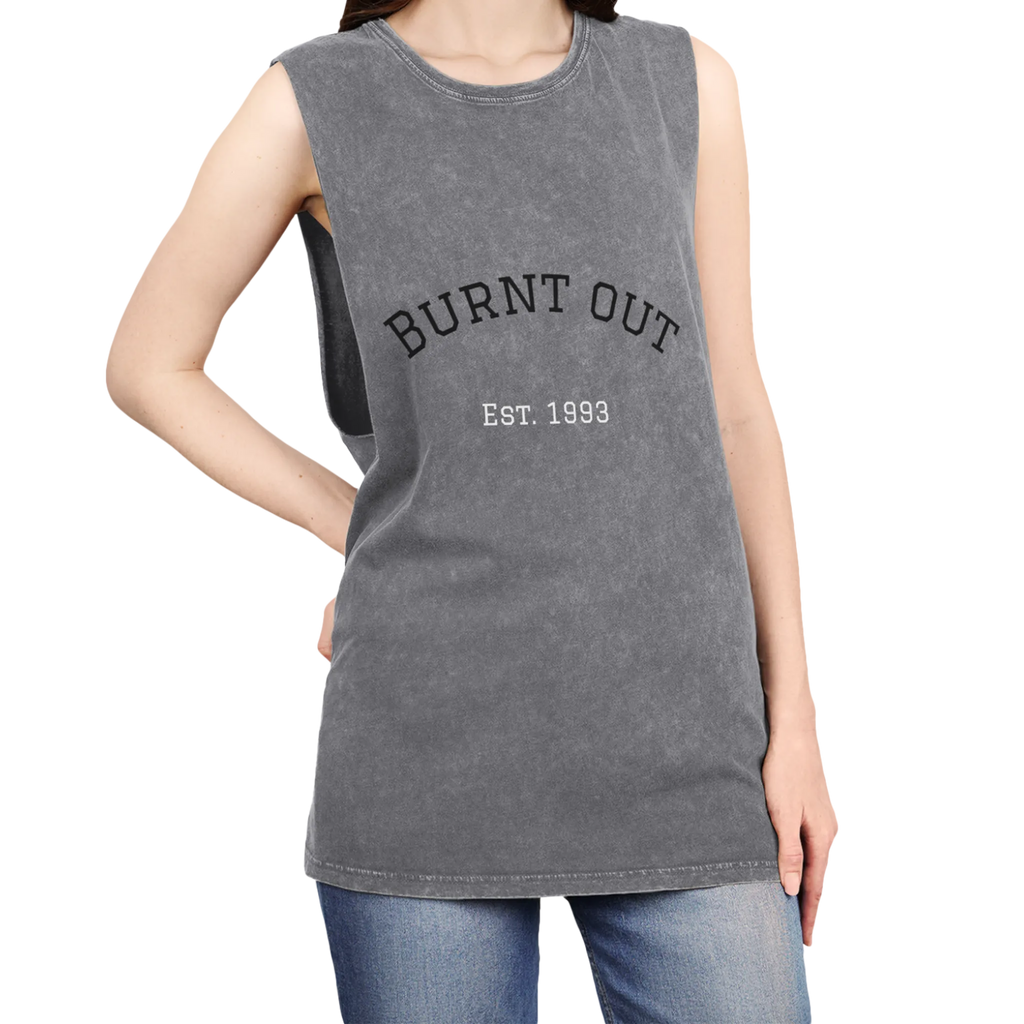 A person wearing the ash stonewash personalized muscle tank with a black arched 'Burnt Out Est. 1993' graphic — custom birth year gift idea for him or her.