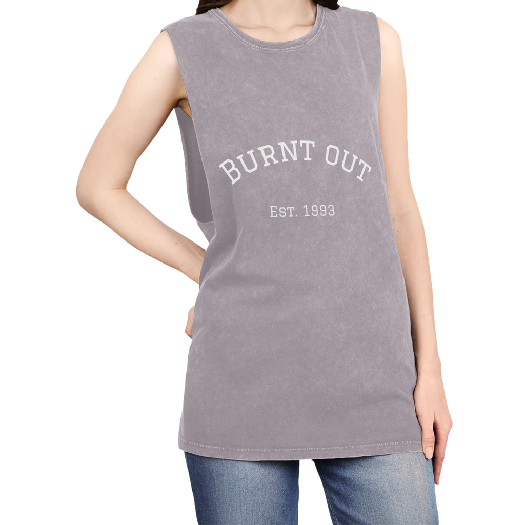 A person wearing the orchid stonewash personalized muscle tank with a white arched 'Burnt Out Est. 1993' graphic — custom birth year gift idea for him or her.