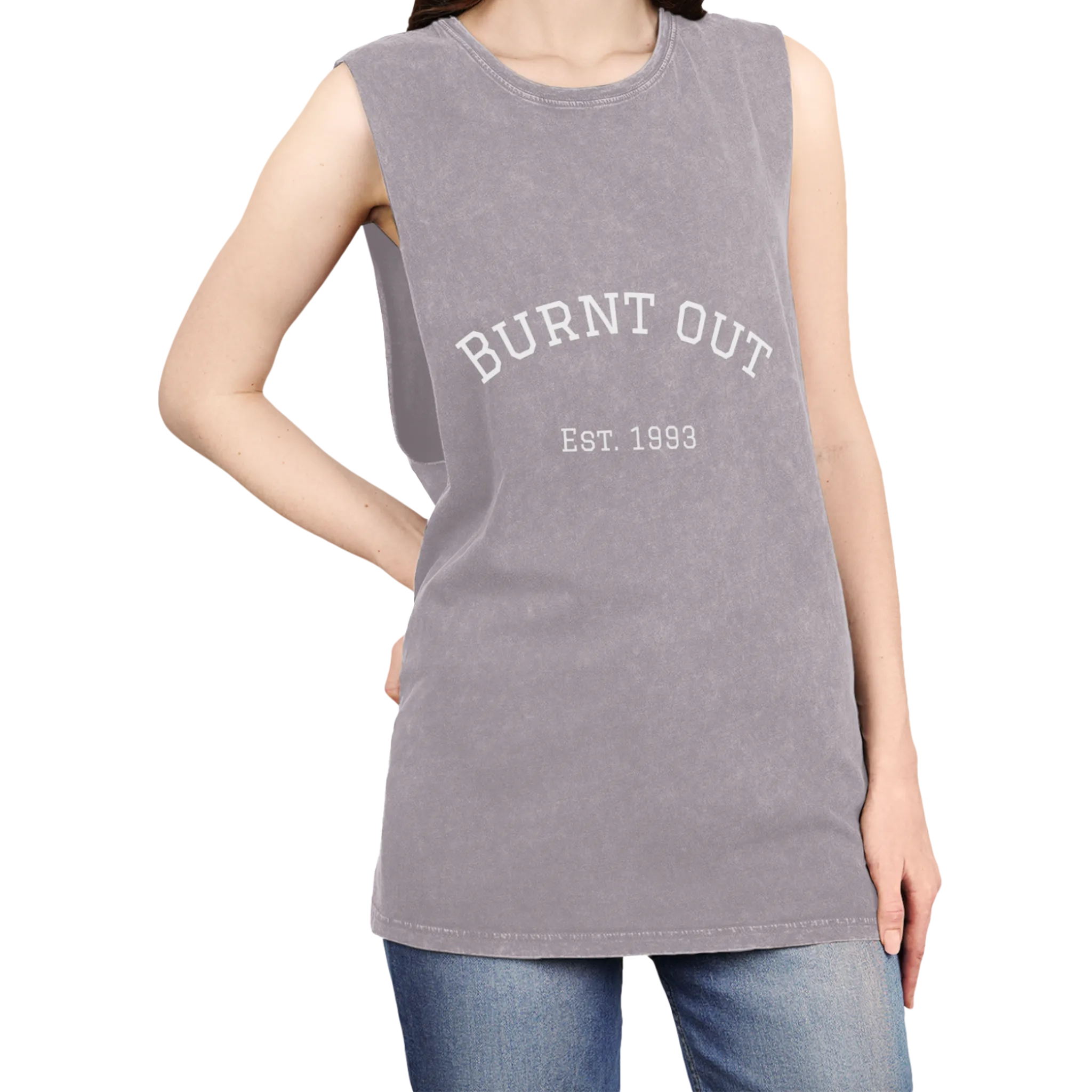 A person wearing the orchid stonewash personalized muscle tank with a white arched 'Burnt Out Est. 1993' graphic — custom birth year gift idea for him or her.
