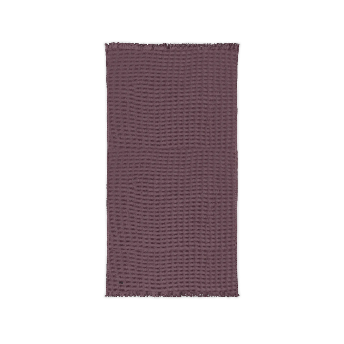 Dusky Orchid cotton waffle throw blanket laid flat, showing its textured surface and fringed ends.
