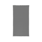 Gusty Grey cotton waffle throw blanket laid flat, showing its textured surface and fringed ends.