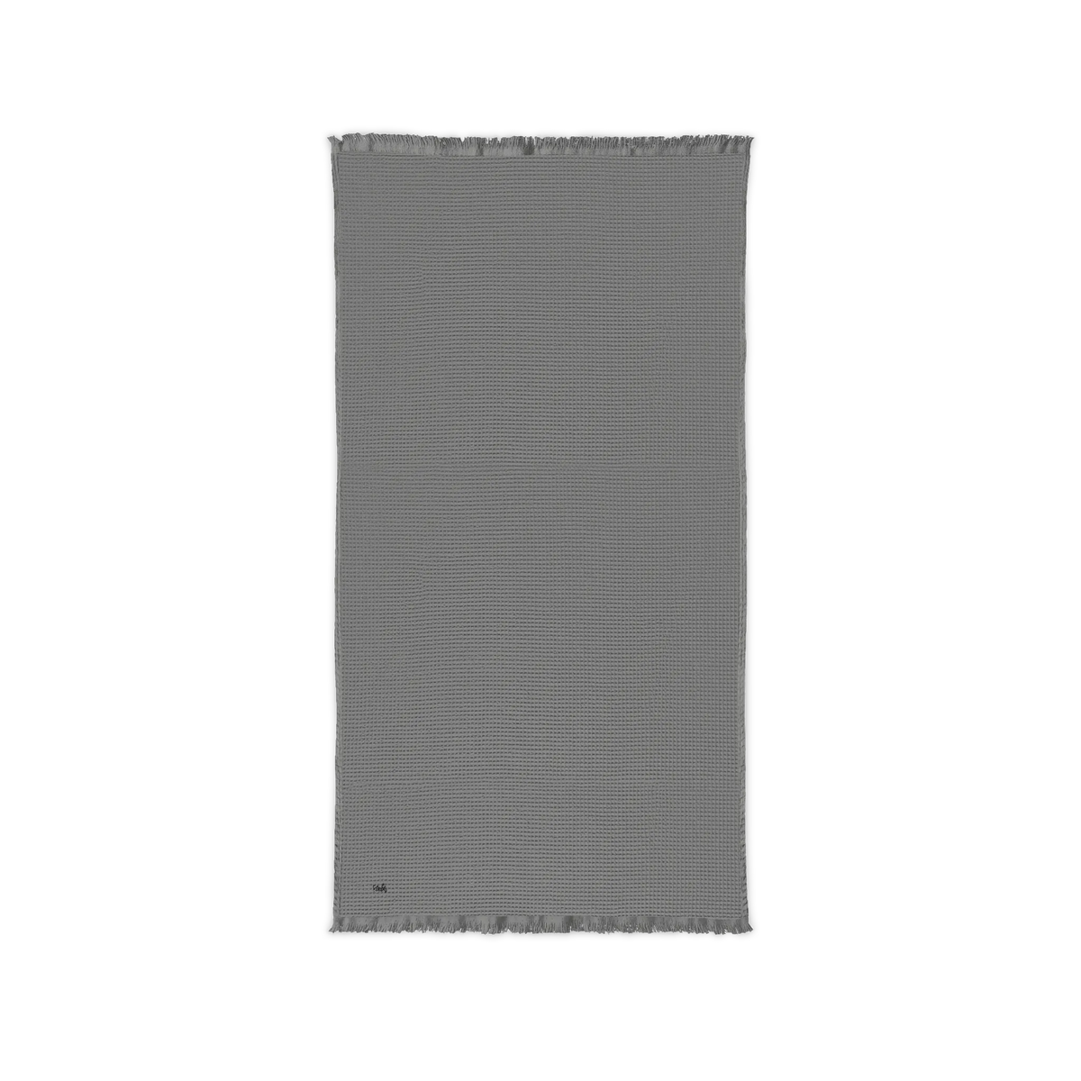 Gusty Grey cotton waffle throw blanket laid flat, showing its textured surface and fringed ends.
