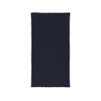 River Blue Navy cotton waffle throw blanket laid flat, showing its textured surface and fringed ends.