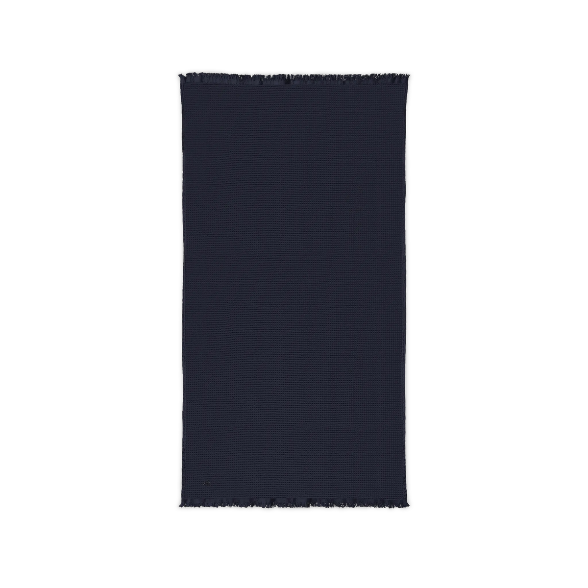 River Blue Navy cotton waffle throw blanket laid flat, showing its textured surface and fringed ends.