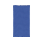 Ultramarine blue cotton waffle throw blanket laid flat, showing its textured surface and fringed ends.