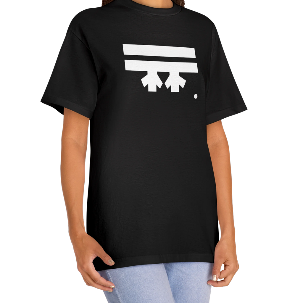 A woman wearing a black FREEBRD Logo Classic T-Shirt, close-up showing the white FREEBRD logo on the chest.
