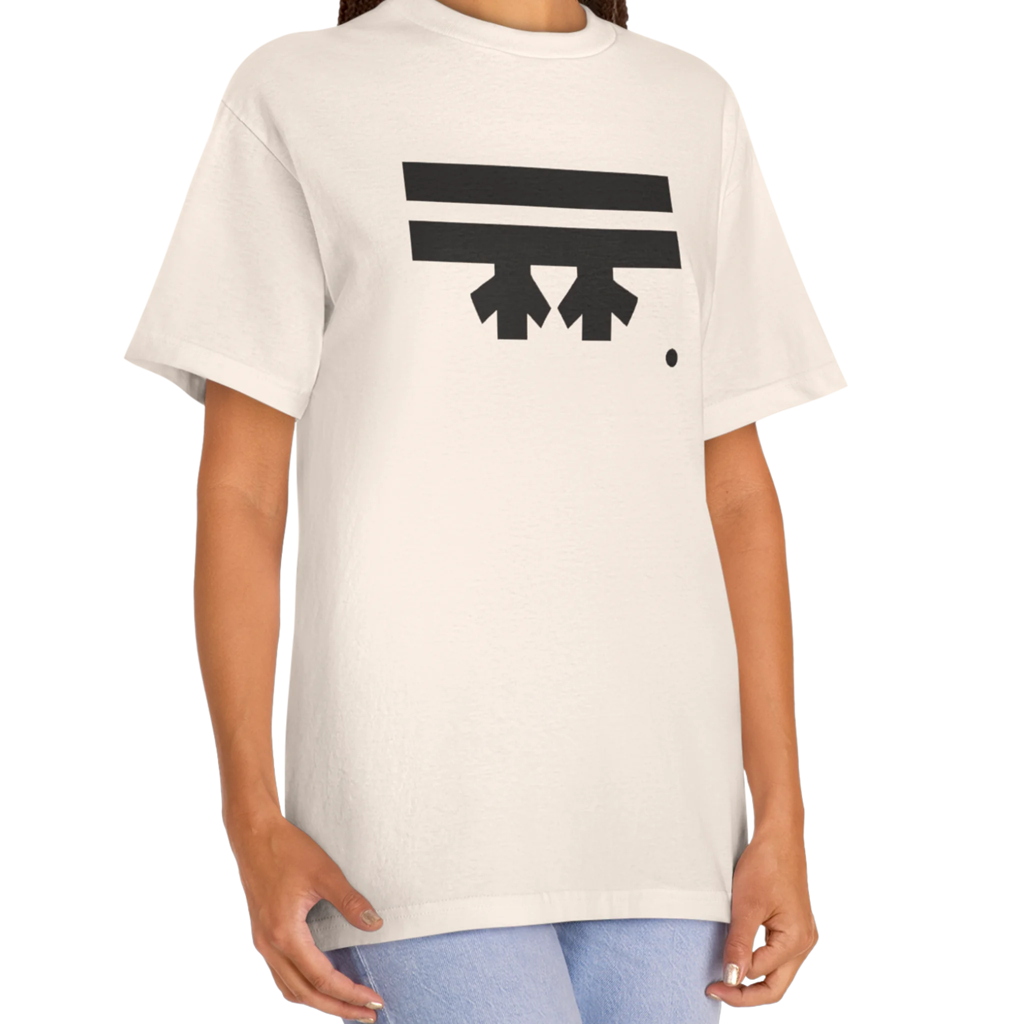 A woman wearing a cream FREEBRD Logo Classic T-Shirt, close-up showing the black FREEBRD logo on the chest.