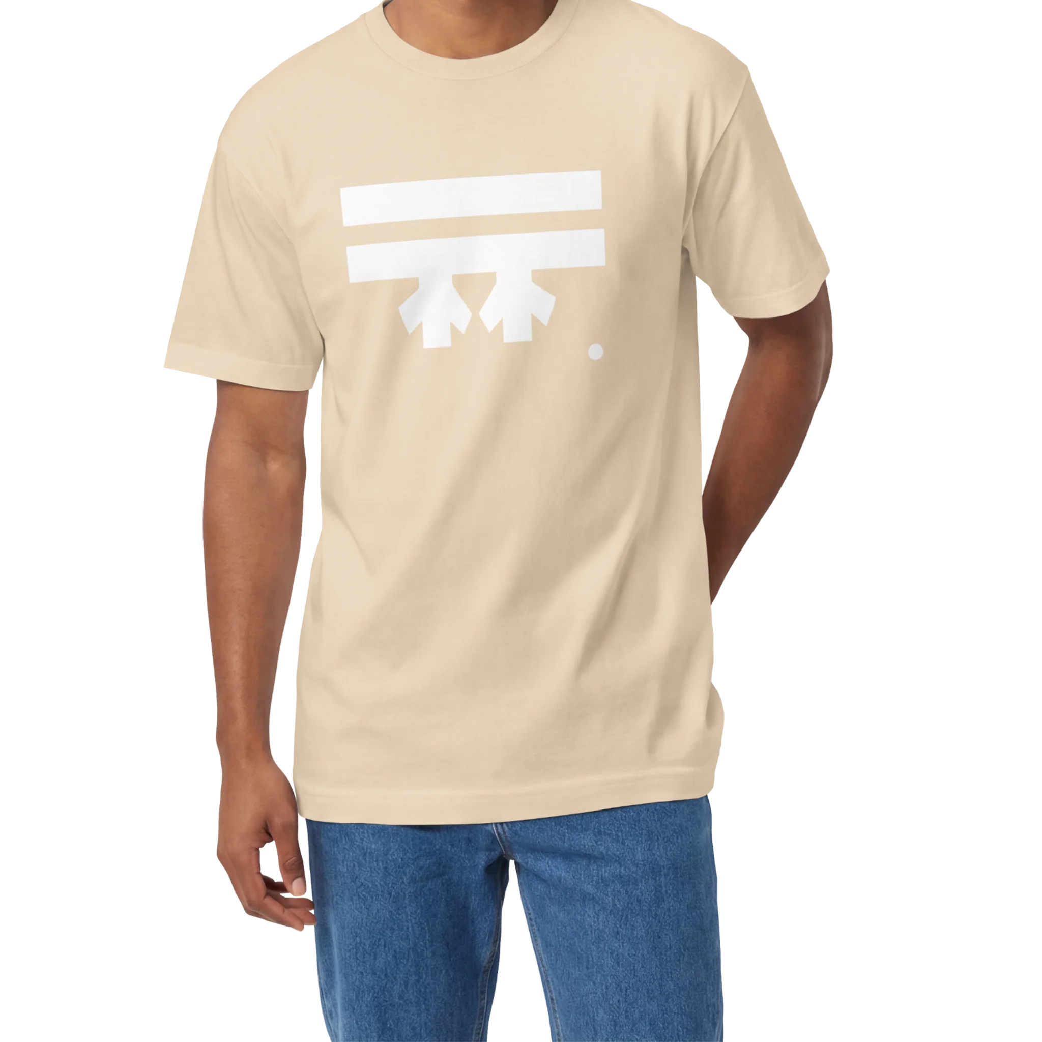 A man wearing a sand FREEBRD Logo Classic T-Shirt, close-up showing the white FREEBRD logo on the chest.