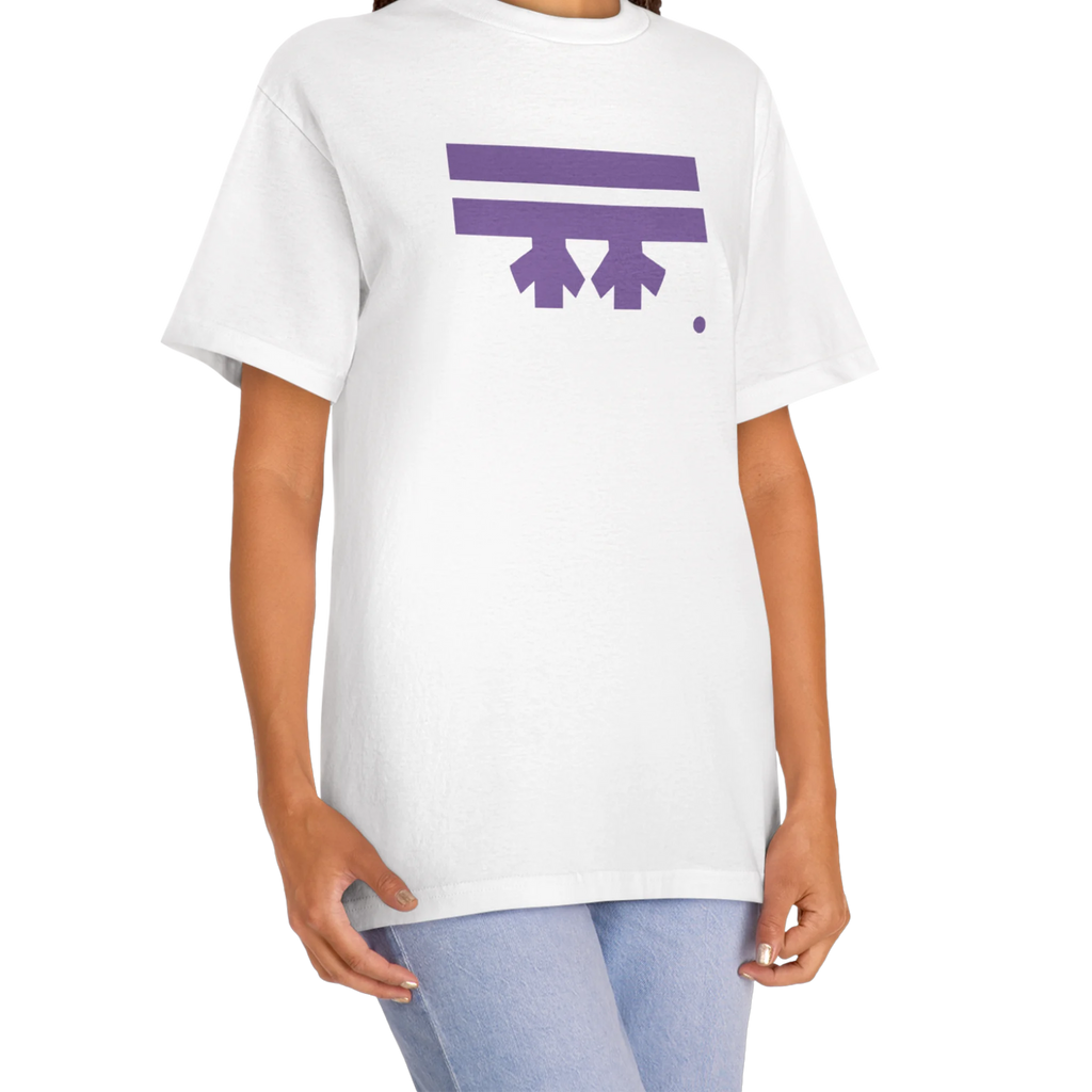 A woman wearing a white FREEBRD Logo Classic T-Shirt, close-up showing the purple FREEBRD logo on the chest.