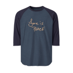 A Heather Denim/Navy Blue Unisex three-quarter Sleeve Baseball Raglan Tee with navy Sleeves on a heather denim shirt and "Love is Peace" in khaki text.