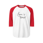 A White/Red Unisex three-quarter Sleeve Baseball Raglan Tee with red sleeves on a white shirt and "Love is Peace" in black text.
