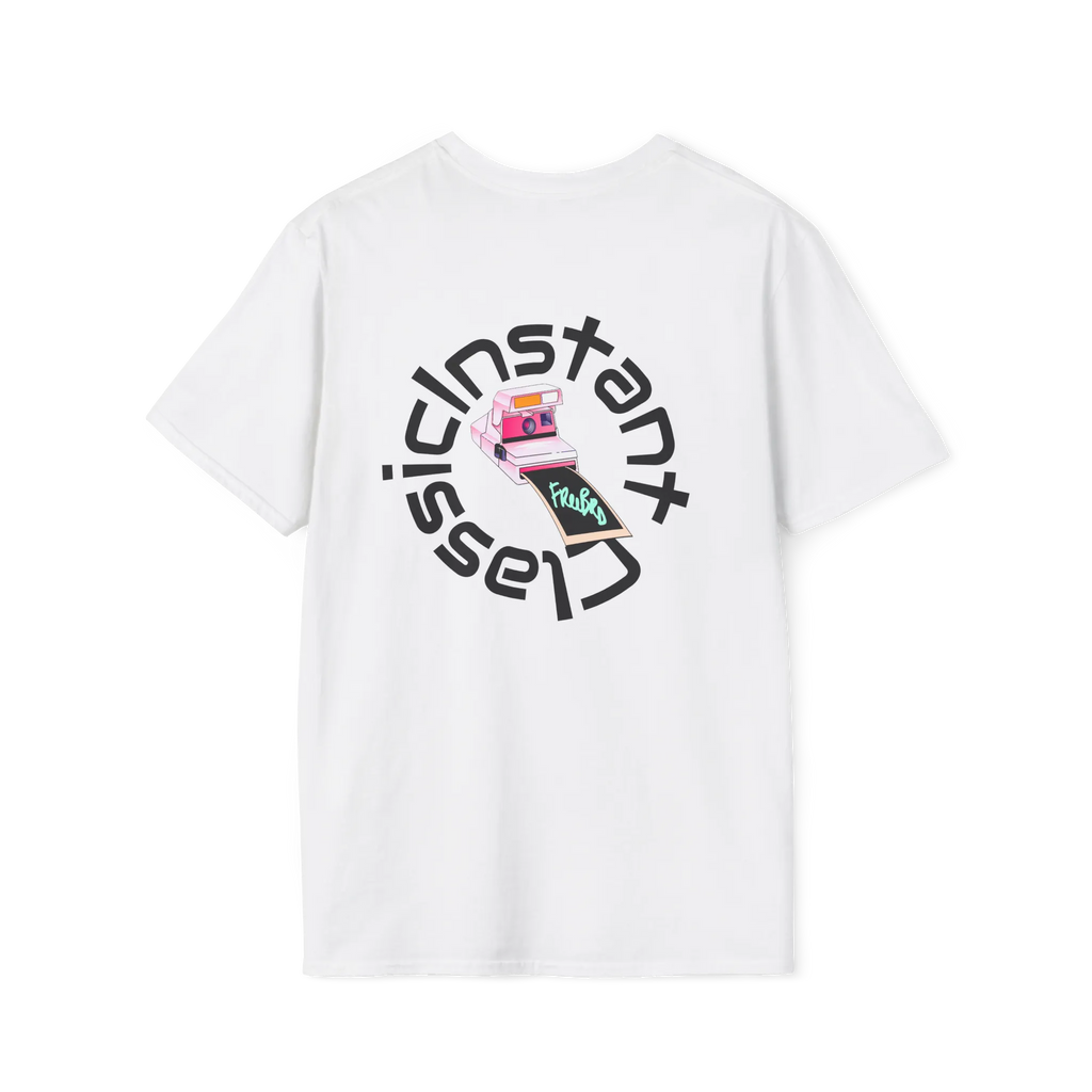A white t-shirt featuring a retro pink polaroid camera with a Freebrd photo print and 'Instant Classic' circular wrap text graphic on the back.