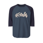 A heather denim raglan tee with navy sleeves featuring the #Freebrd graphic in beige with a light blue shadow.