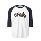 A white raglan tee with navy sleeves featuring the #Freebrd graphic in brown with a black shadow.