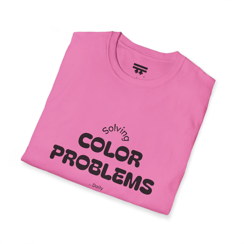 A folded preview of the pink azalea t-shirt with 'solving color problems daily’ black text design on the chest.