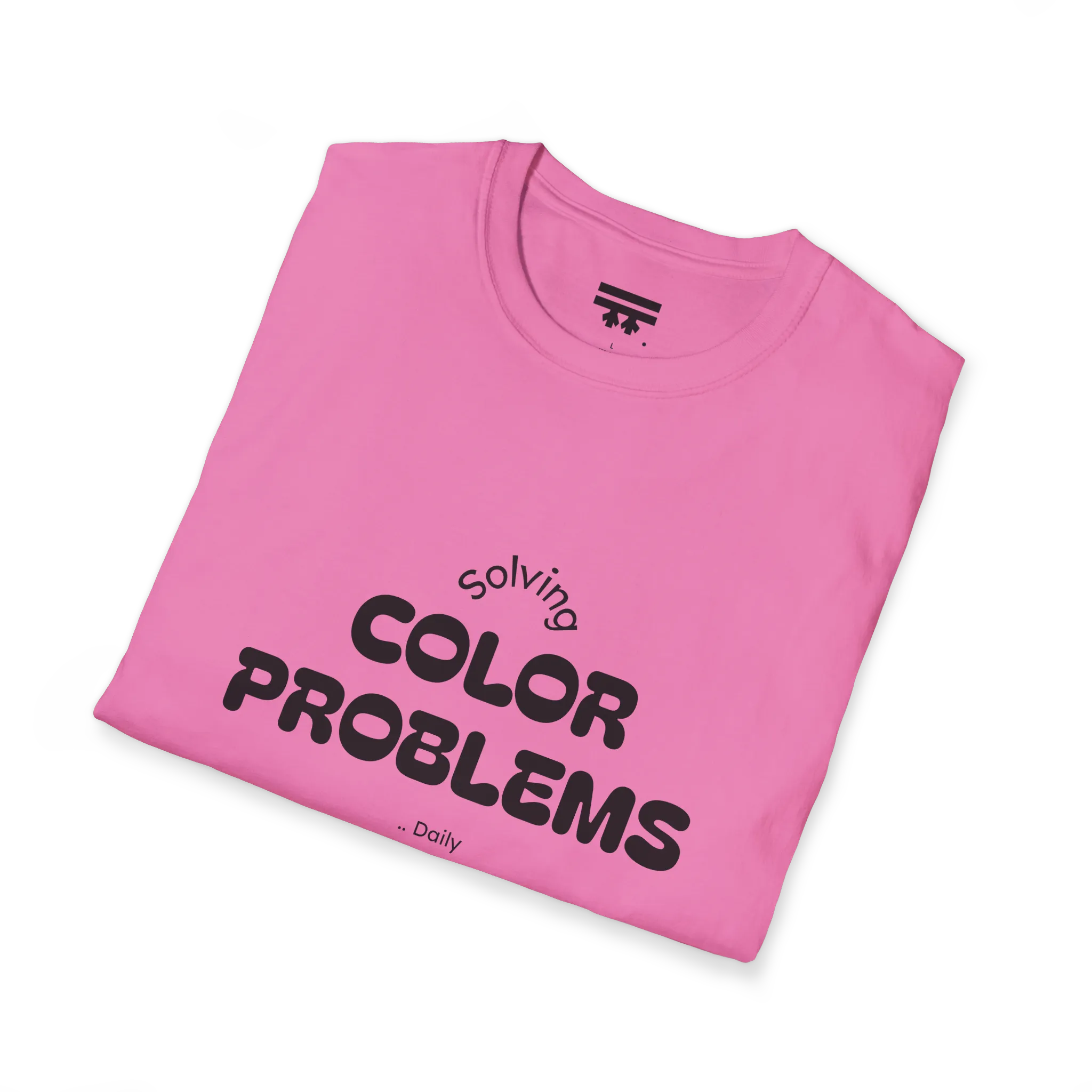 A folded preview of the pink azalea t-shirt with 'solving color problems daily’ black text design on the chest.