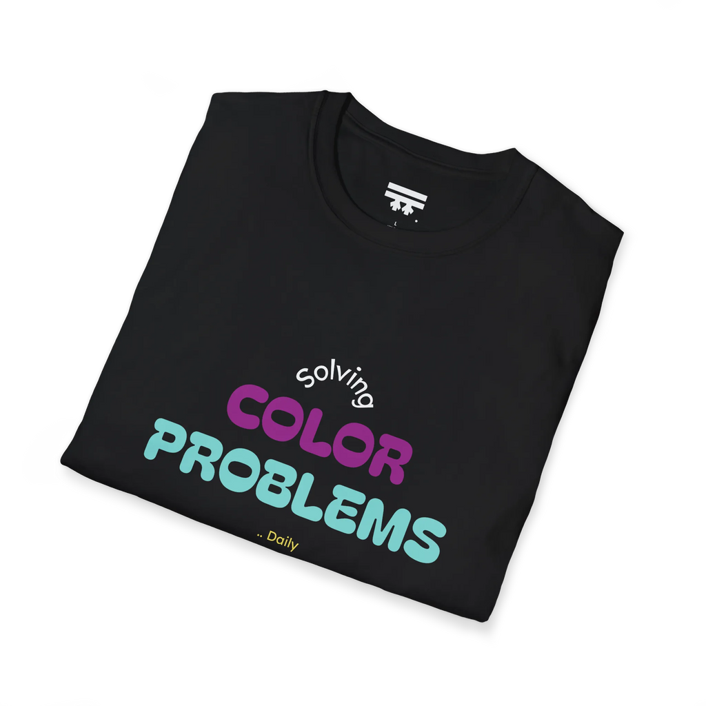 A folded preview of the black t-shirt with 'solving color problems daily' text design in white, yellow, teal and magenta lettering.