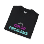 A folded preview of the black t-shirt with 'solving color problems daily' text design in white, yellow, teal and magenta lettering.