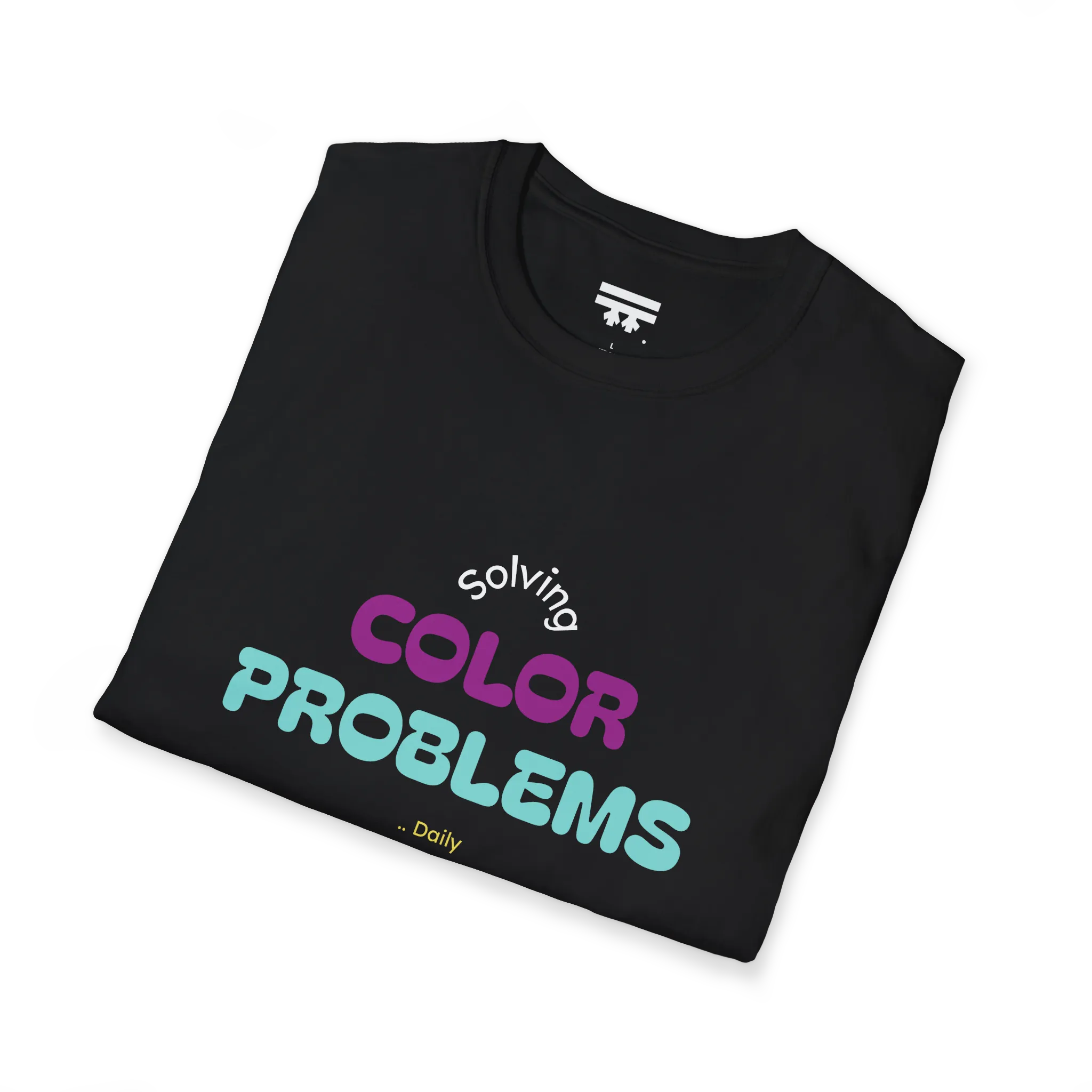 A folded preview of the black t-shirt with 'solving color problems daily' text design in white, yellow, teal and magenta lettering.