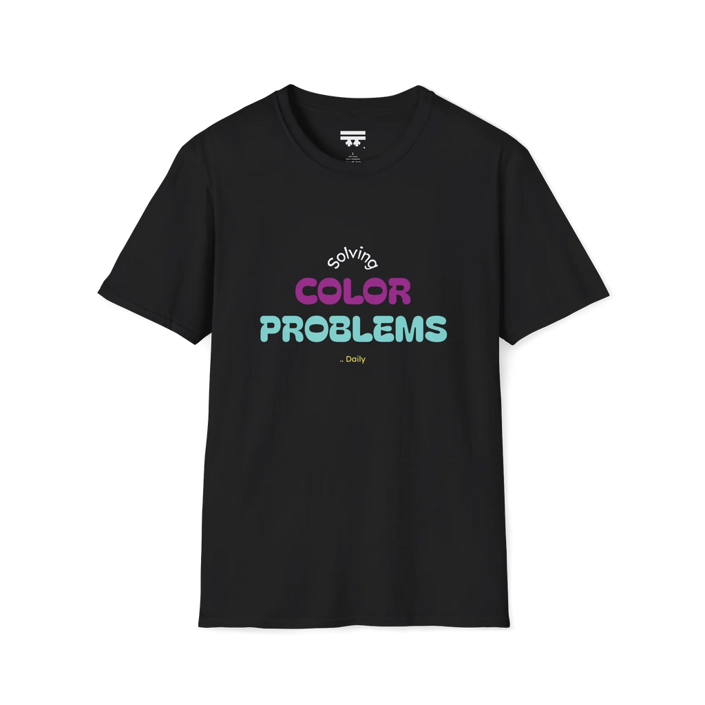 A front preview of the black t-shirt with 'solving color problems daily' text design in white, yellow, teal and magenta lettering on the chest.