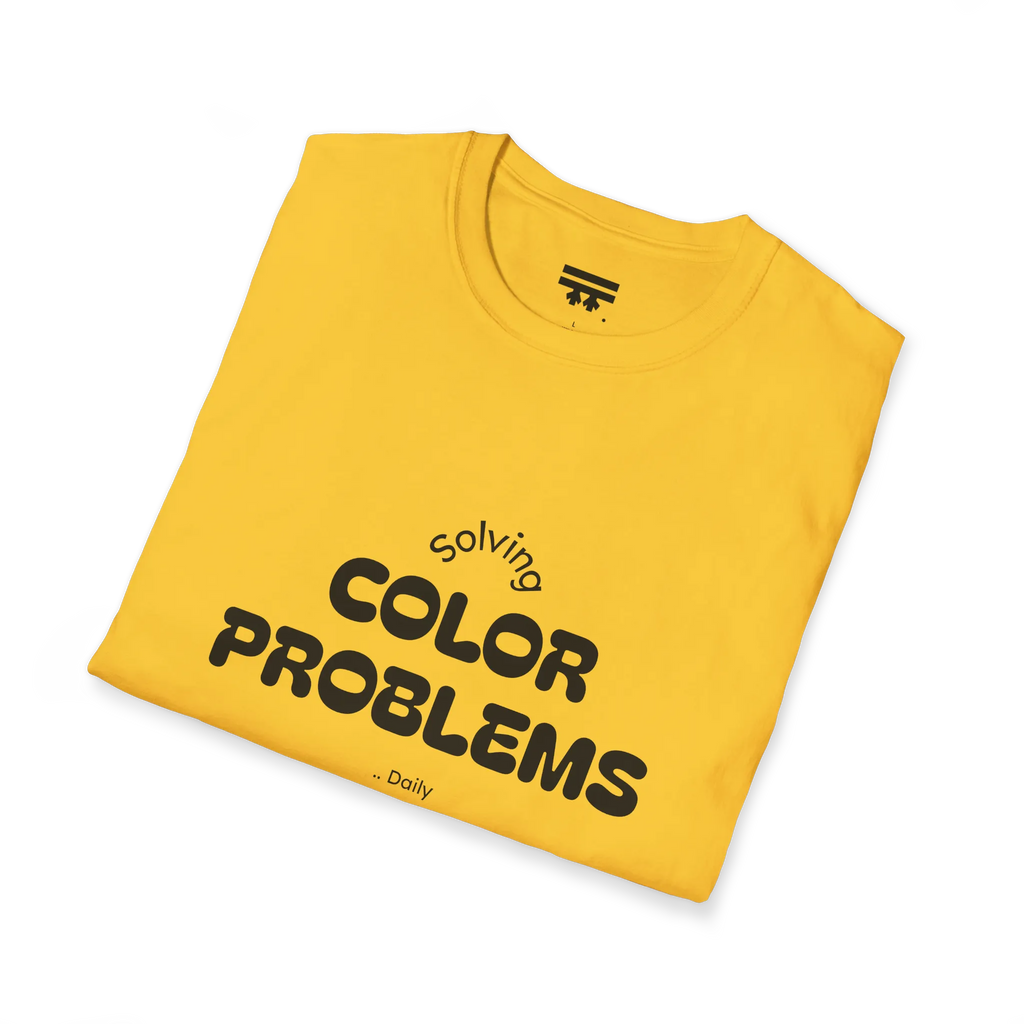 A folded preview of the yellow daisy t-shirt with 'solving color problems daily' black lettering text design on the front.