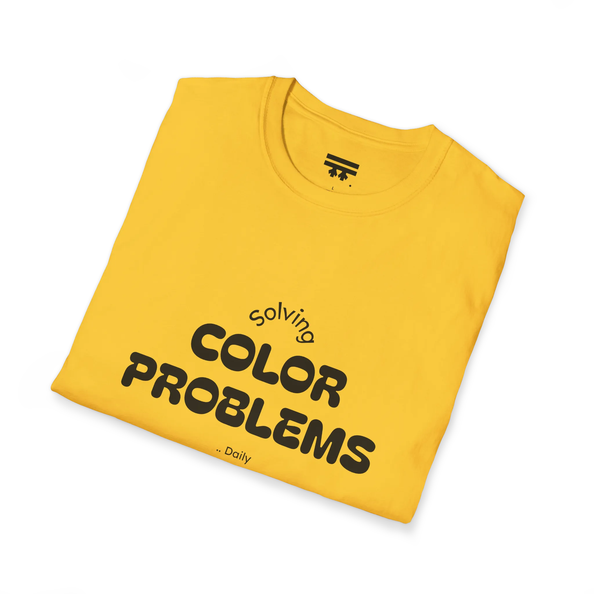 A folded preview of the yellow daisy t-shirt with 'solving color problems daily' black lettering text design on the front.