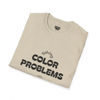 A folded preview of the sand t-shirt with 'solving color problems daily' black lettering text design on the front.