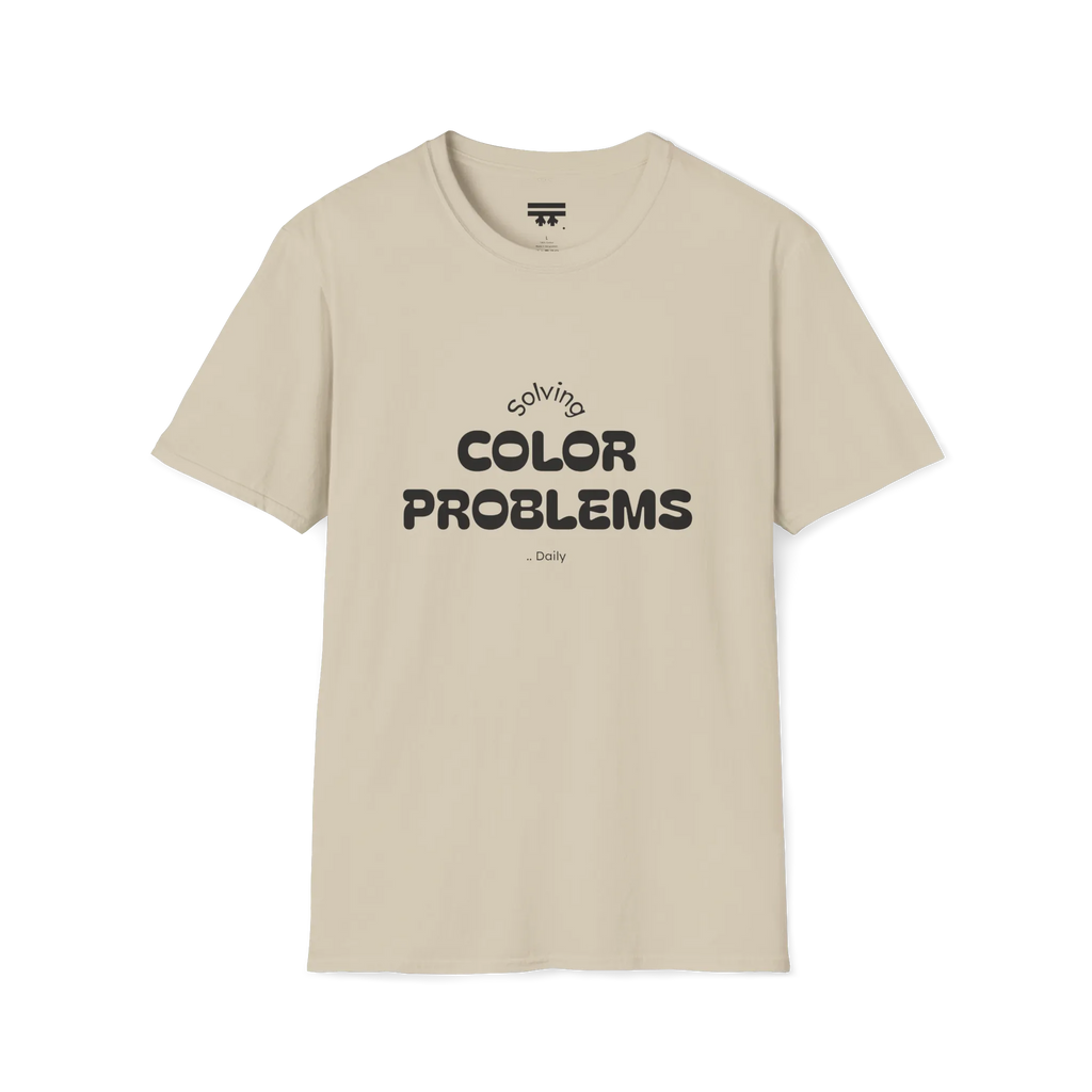 A front preview of the sand t-shirt with 'solving color problems daily' black lettering design on the chest.