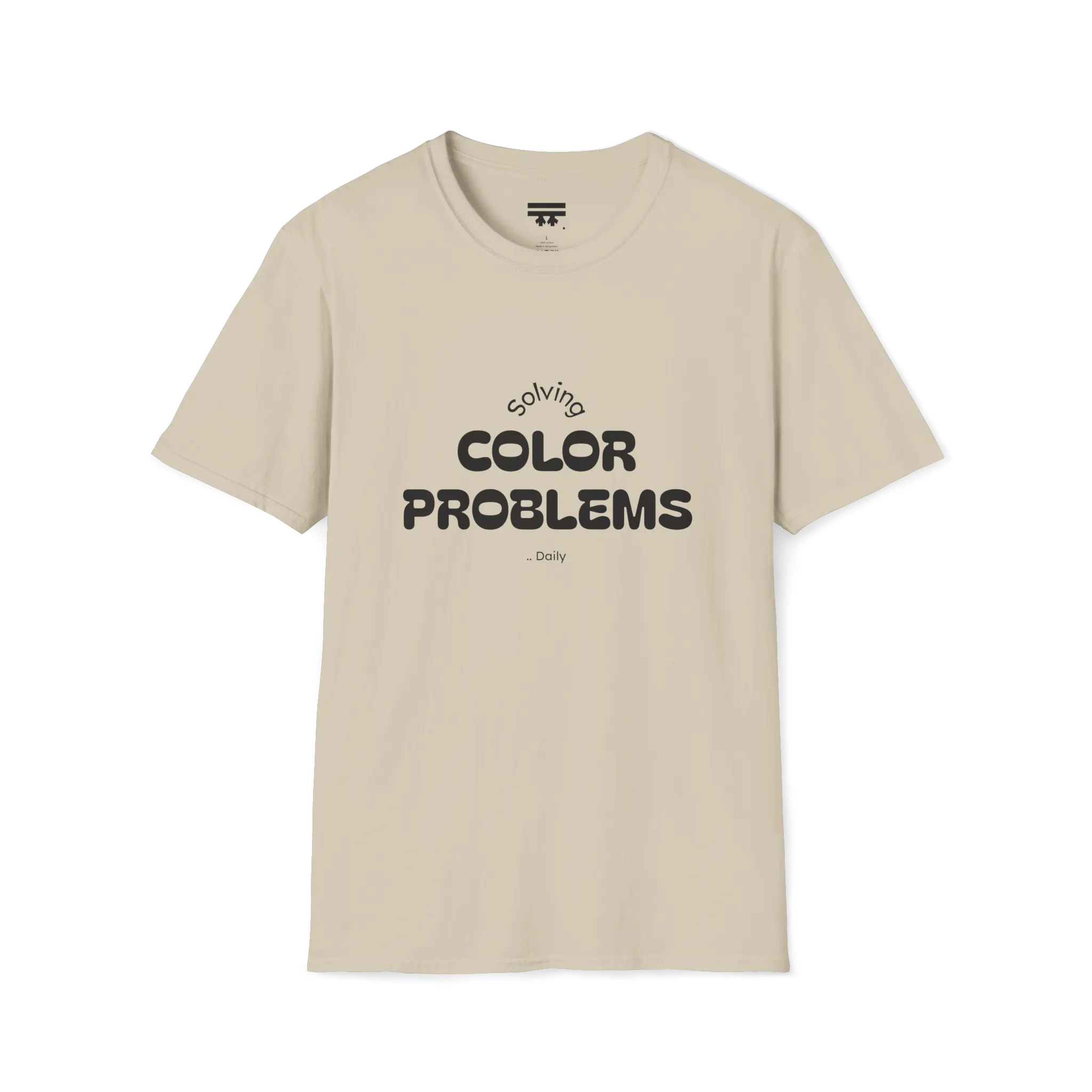 A front preview of the sand t-shirt with 'solving color problems daily' black lettering design on the chest.