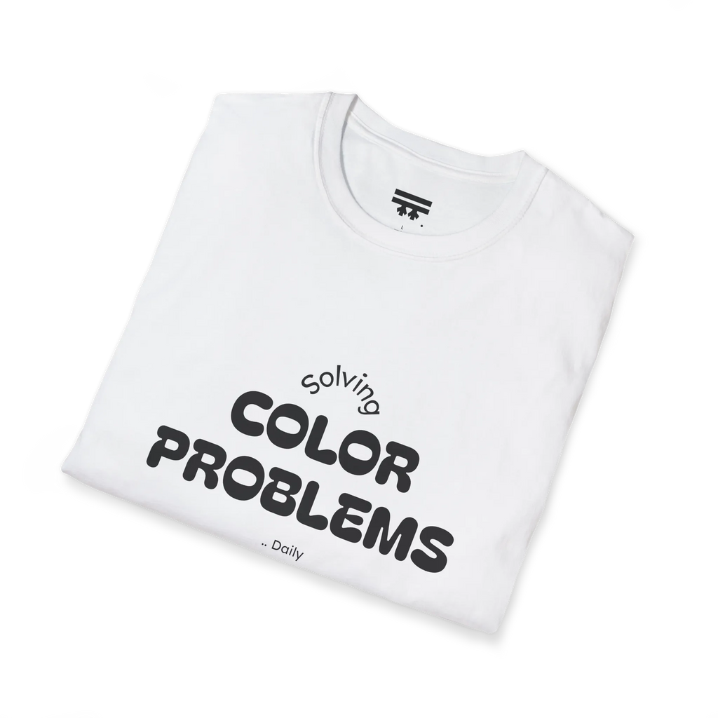 A folded preview of the white t-shirt with 'solving color problems daily' black lettering text design.