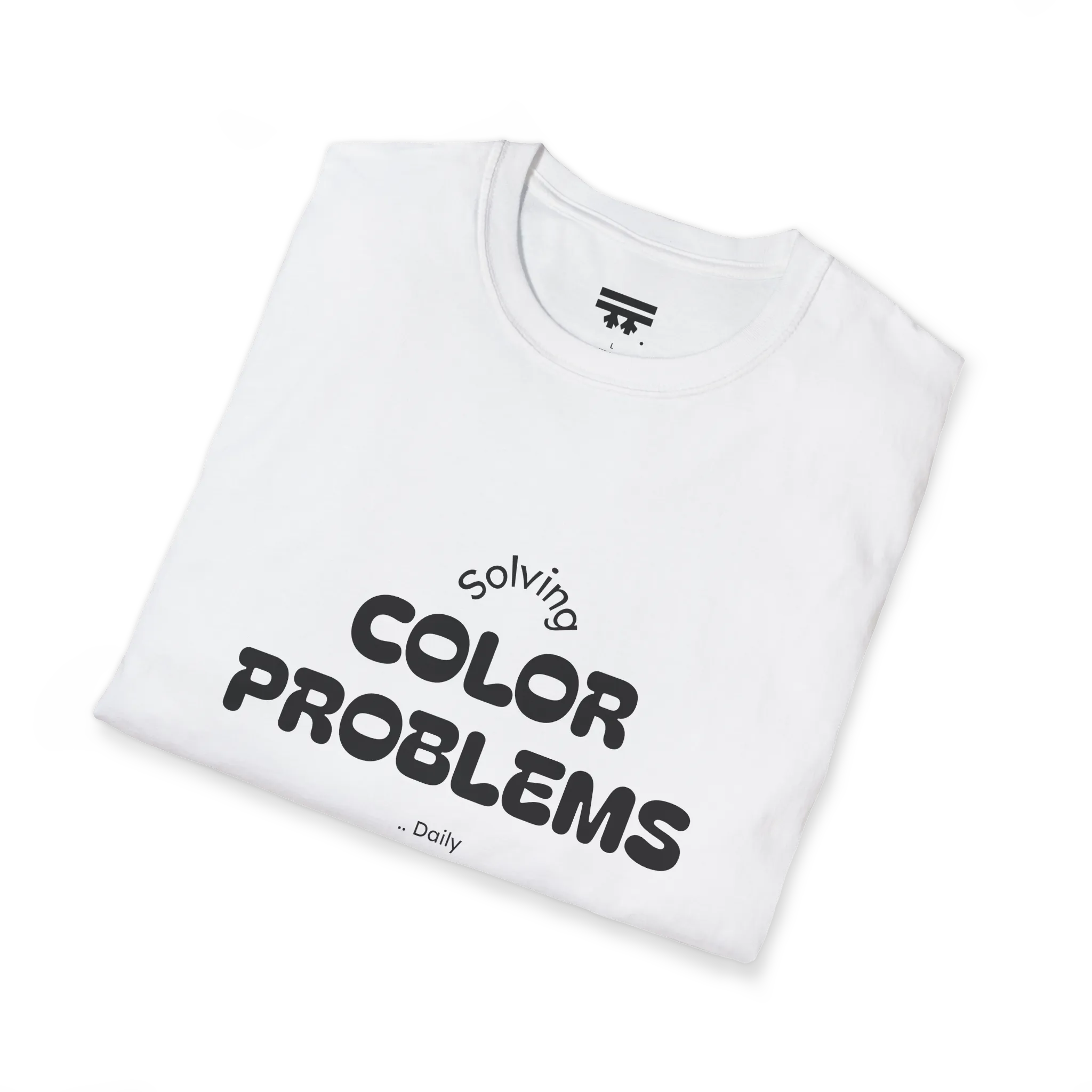 A folded preview of the white t-shirt with 'solving color problems daily' black lettering text design.