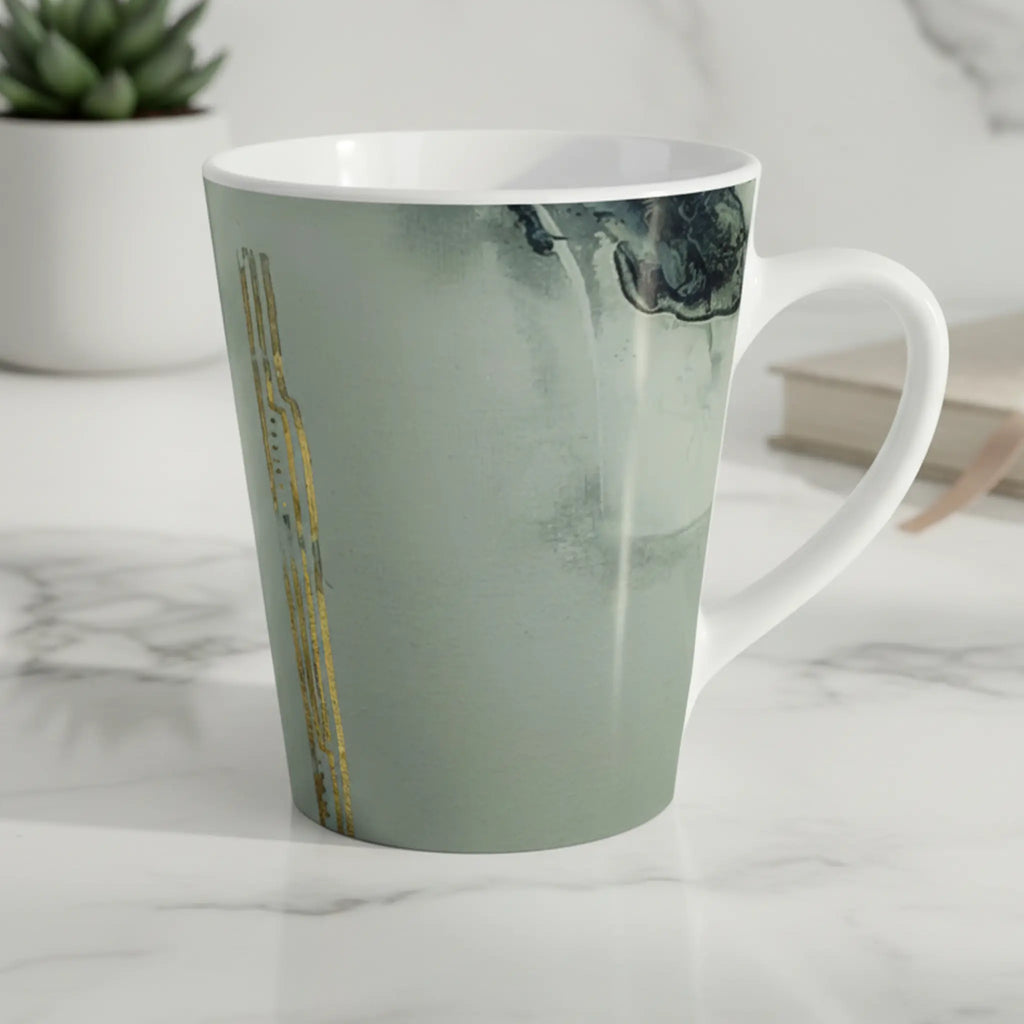 Freebrd Tu Gough abstract marble latte mug with black and gold accents sitting on a clean modern kitchen counter in soft natural morning light.
