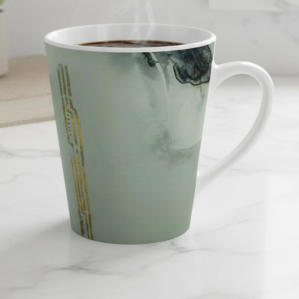 Freebrd Tu Gough abstract marble latte mug with black and gold accents on a modern kitchen counter bathed in soft diffused morning light.